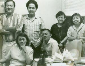 A group of six Philippine journalists face the camera for a photo in an office.